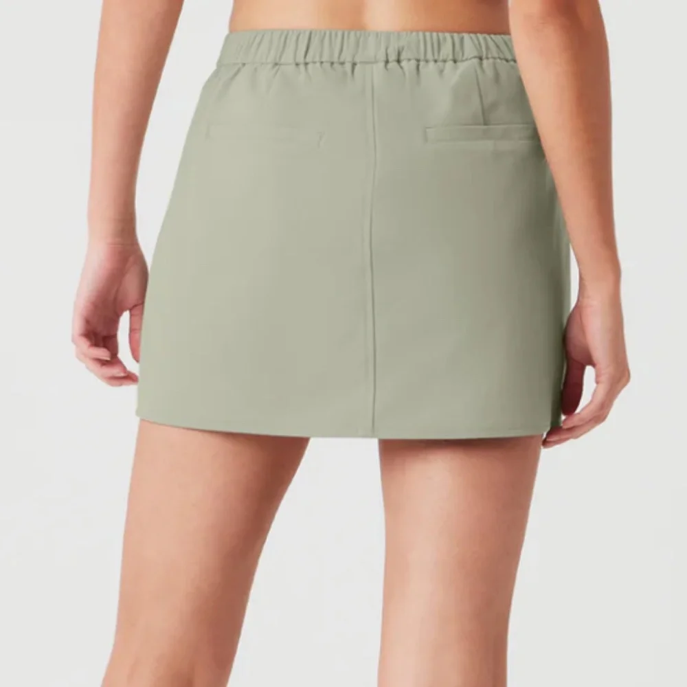 ALO | LIGHT GREEN HIGH SPEED MINI SKIRT IN LIMESTONE | XS